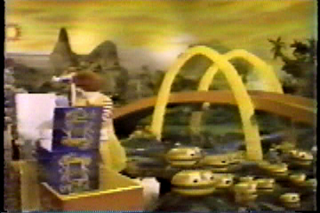Ronald McDonald picking hamburgers from the "hamburger patch"